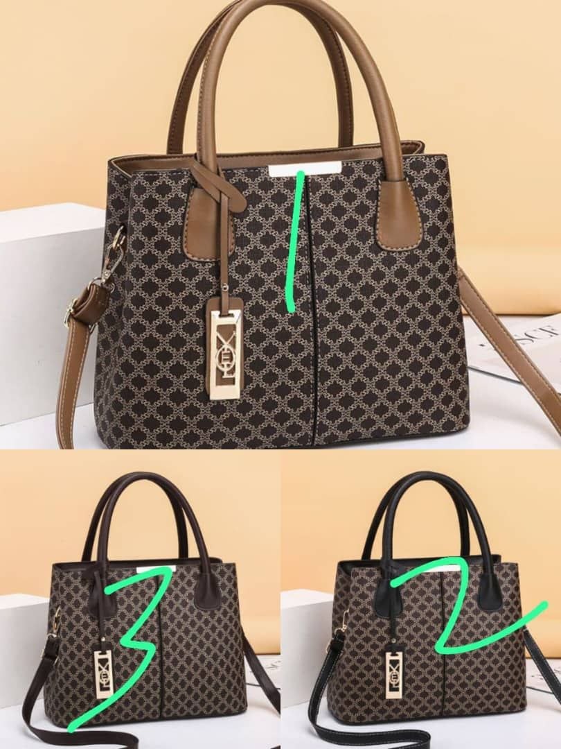 Patterned Handbag Collection with detachable strap and elegant gold emblem Available in 3 stylish trims